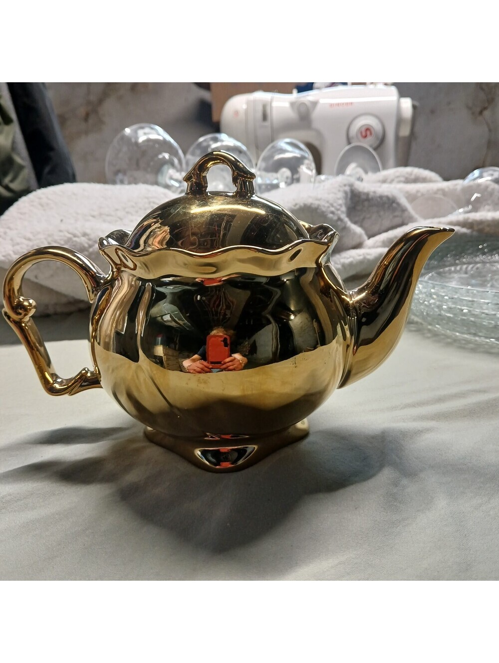 gold porcelain teapot, gleaming, unique one of a kind item